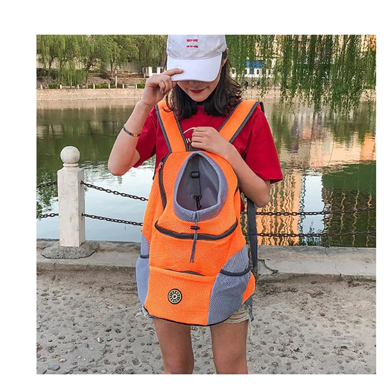 Unisex pet carrier backpack for dogs & cats, hands-free travel, breathable mesh, durable fabric.