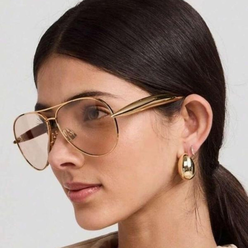 Stylish silver metal frame unisex aviator sunglasses, tinted lenses for essential UV400 eye protection.