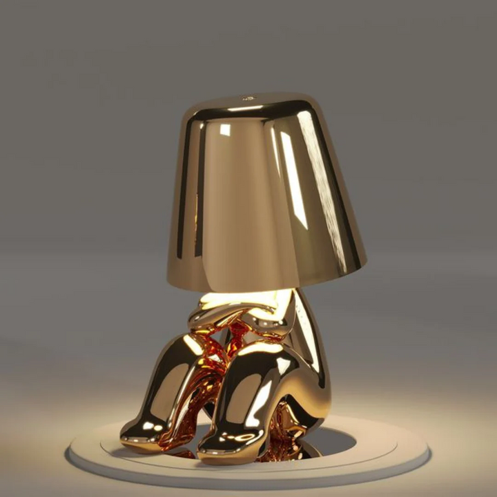 Hand interacting with the touch control of the Playful Dimmable LED Artist Table Lamp