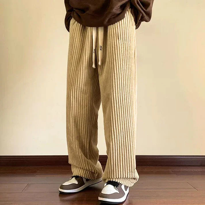 Black plush comfort sweatpants for unisex, featuring a relaxed fit & drawstring, great for cozy everyday wear.