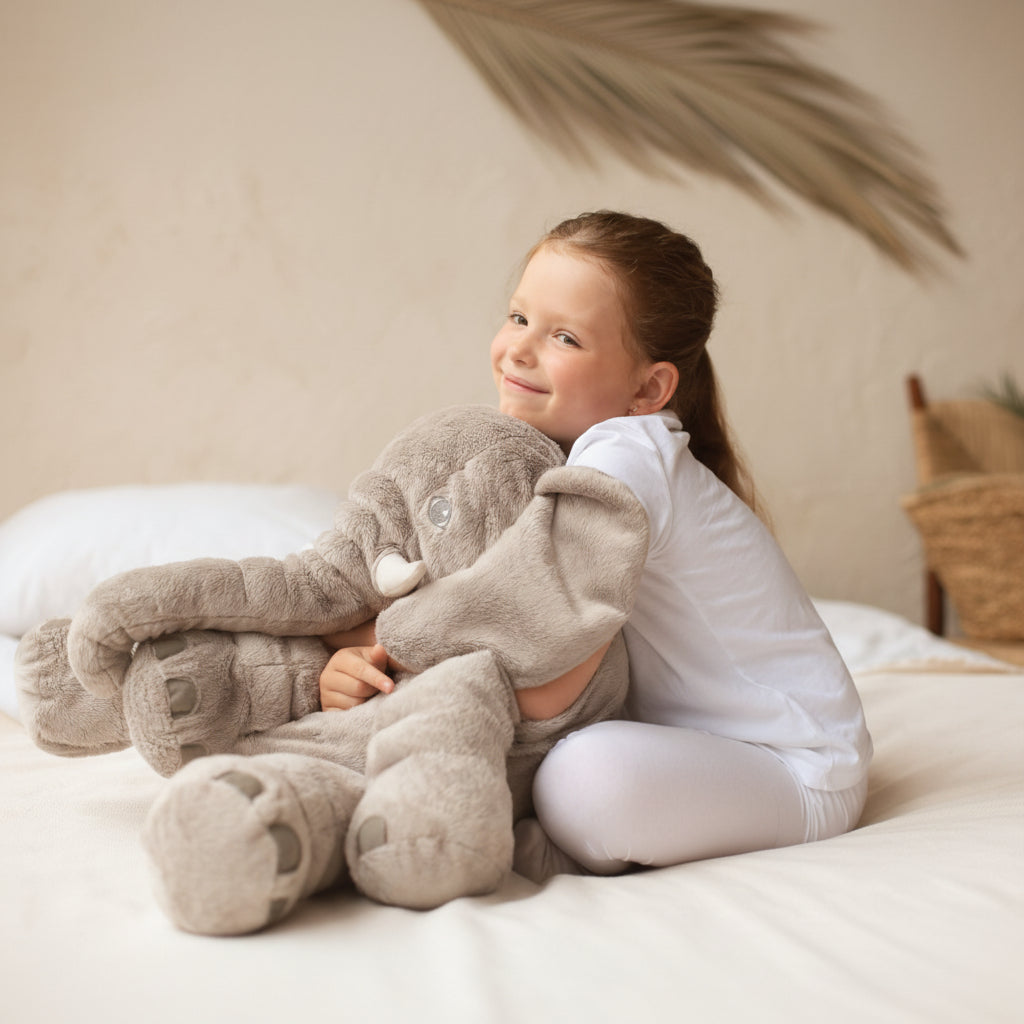Unisex elephant plush pillow for cuddles, play, and nursery decor. A soft stuffed animal & comfort pillow.