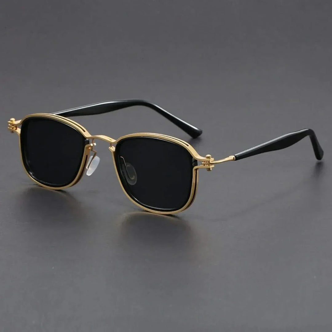 Unisex polarized sunglasses with stylish gold metal frame & black lenses. Offers UV protection & anti-glare.