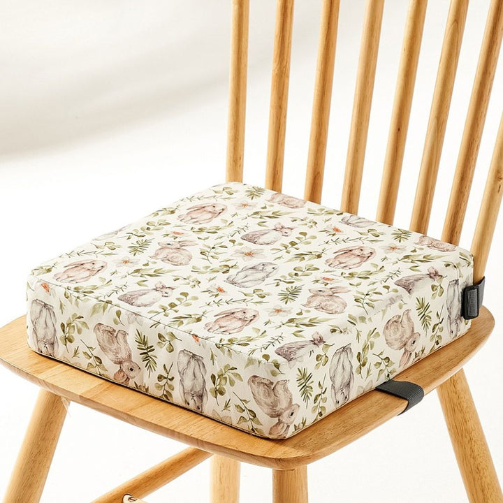 Adjustable portable high chair booster for secure baby dining & kids meals.
