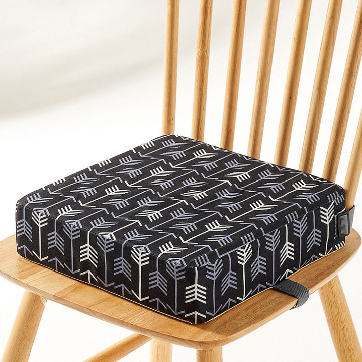 Comfortable unisex portable booster seat, a compact child seat for any dining occasion.