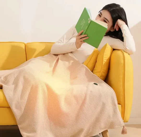 USB heated fleece shawl blanket providing portable electric warmth & infrared therapy for travel or home office.