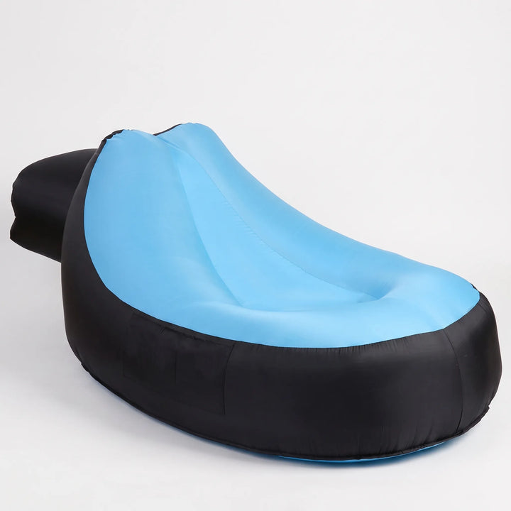 Comfortable inflatable beach lounger for poolside, camping, and outdoor events. Portable and easy to inflate.