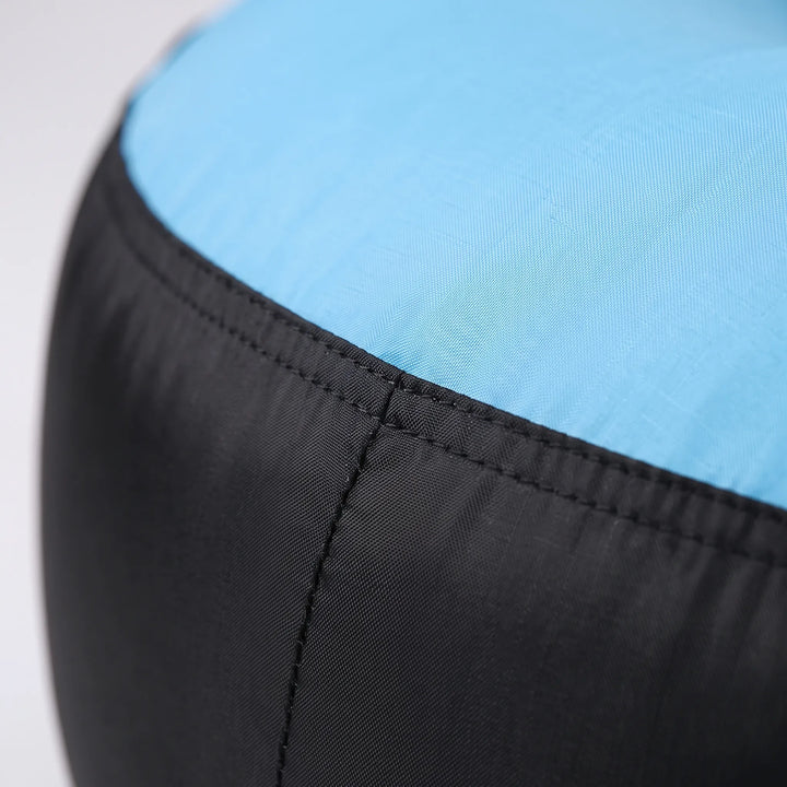 Versatile inflatable outdoor lounger. Portable seat for garden, beach lounge, or camping gear. Unisex design.