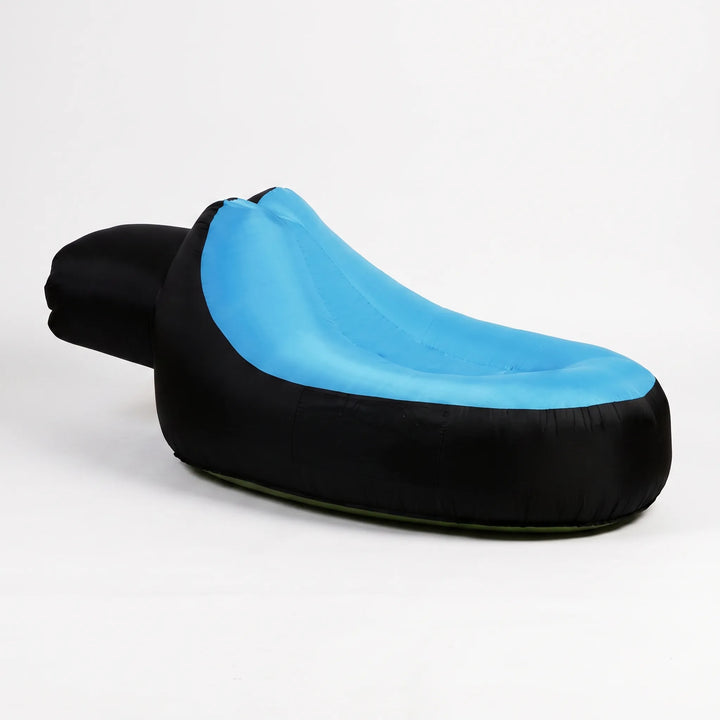 Easy setup inflatable outdoor lounger. Enjoy travel comfort, beach relaxation, or garden lounging with this portable seat.
