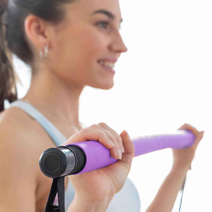 Compact Pilates bar for versatile home exercise, ideal for toning muscles & improving flexibility with resistance.