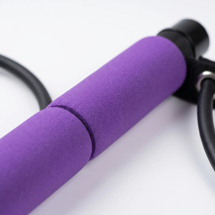 Portable Pilates bar kit with foot loops & resistance bands for yoga, strength training, and active fitness.