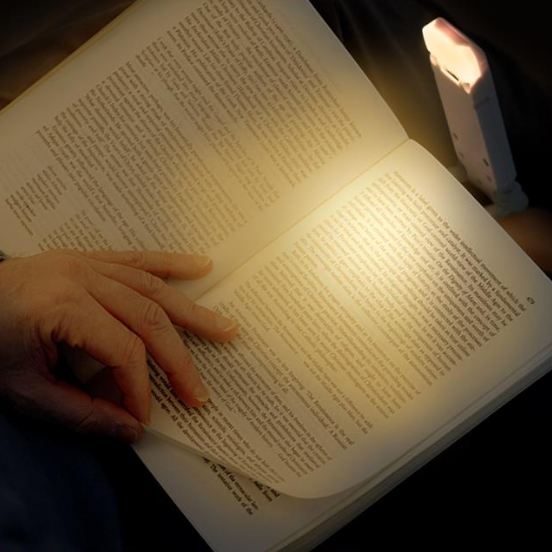 Close up of LumaRead portable LED reading lamp with eye protection, dimmable, clip-on design