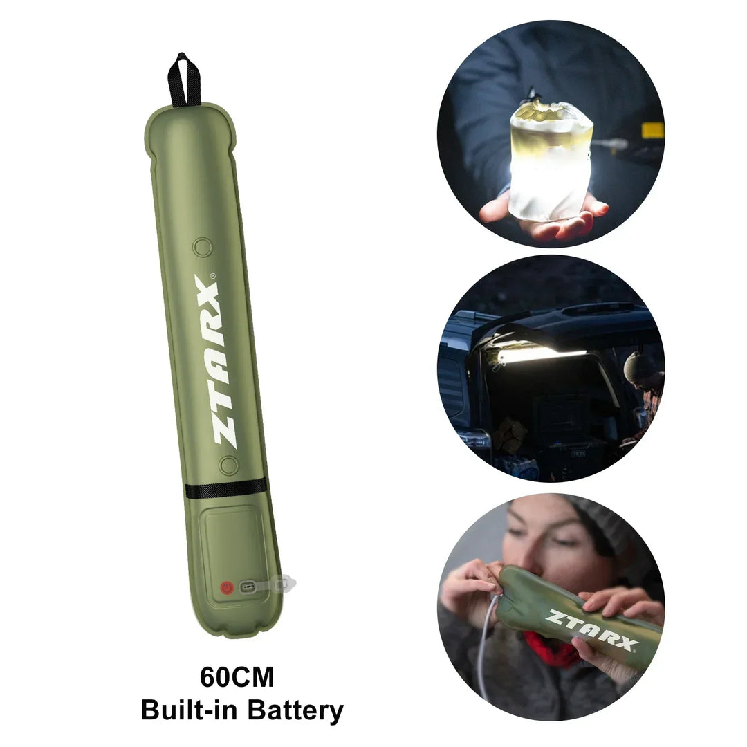 Inflated LumiGlow Pro solar LED tube light, glowing brightly, illuminating a campsite at night.