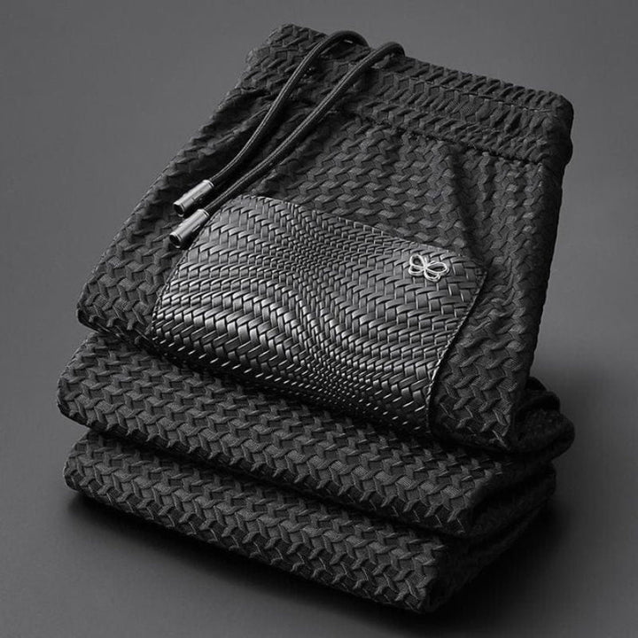 Person relaxing at home in a cozy unisex jacquard lounge set, pure comfort style.