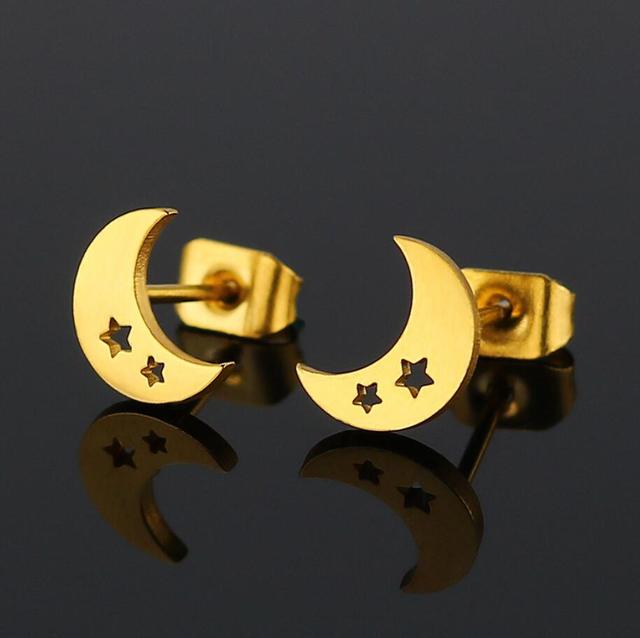 Close-up of bold punk stud earrings, unisex accessory for an edgy fashion statement.