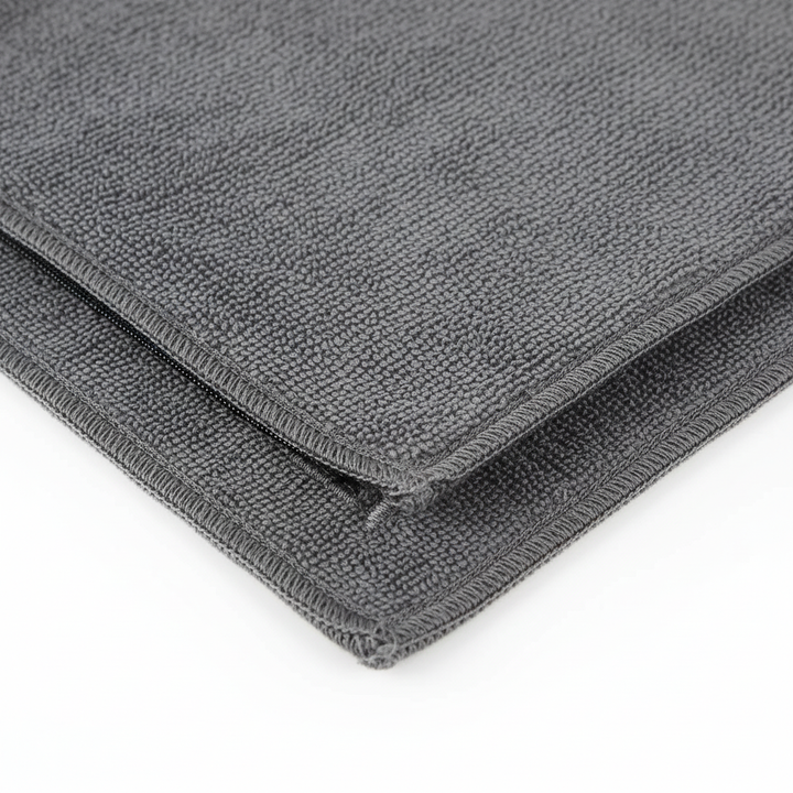 Dual-sided workout accessory: grey quick-dry gym towel with integrated zipper pocket.