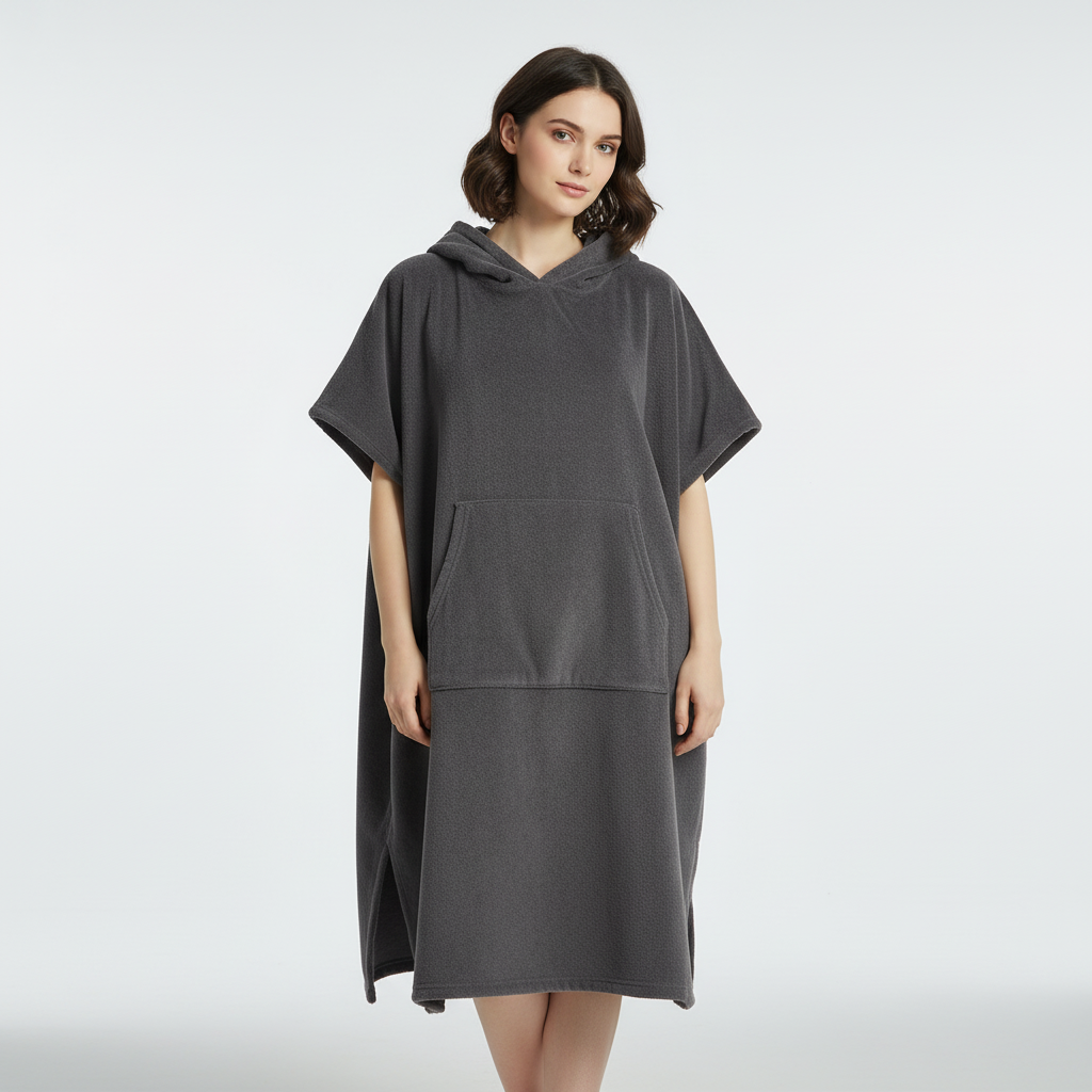 Unisex quick-dry microfiber poncho for watersports, shown in a folded state, highlighting its compact travel size