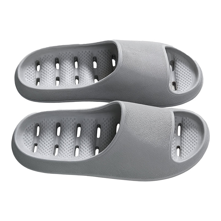 Comfortable, non-slip unisex shower slippers; quick-drying with effective drainage for hygiene.