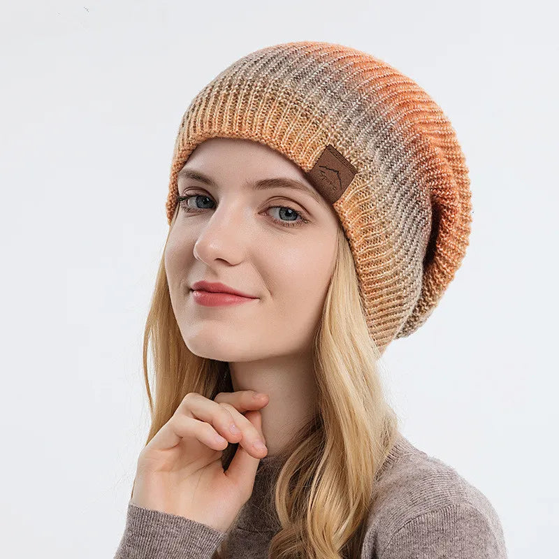 Unisex rainbow knit beanie hat, colorful and warm, perfect for winter fashion. Soft and comfortable.