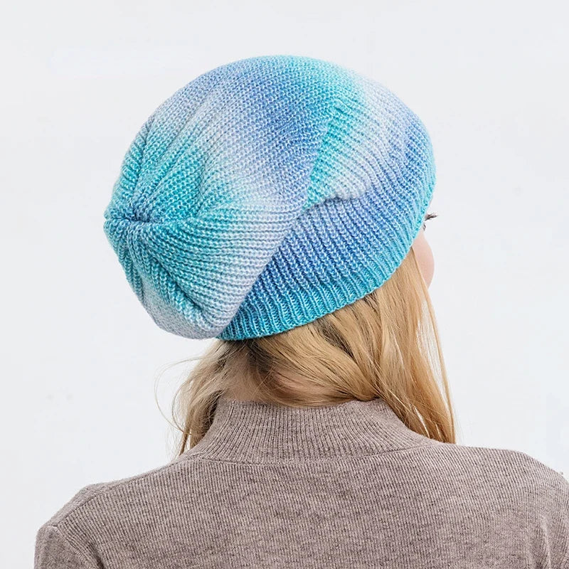Vibrant rainbow knit beanie hat, ideal for keeping warm in winter. Unisex and fashionable.