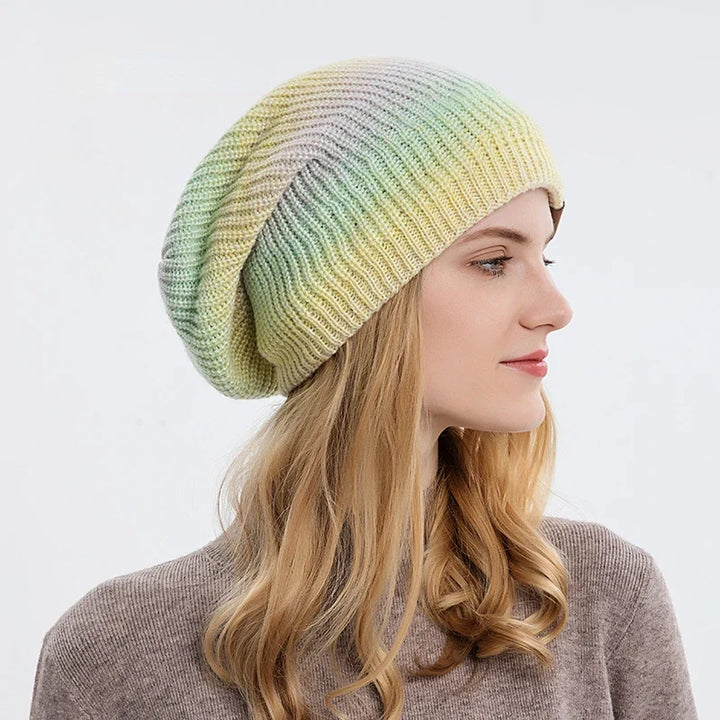 Cozy knit rainbow beanie, soft and warm. A colorful unisex hat for winter style and comfort.