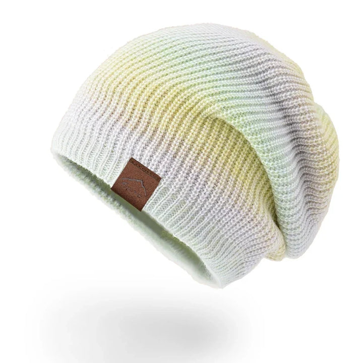 Fashionable rainbow knit beanie hat, unisex design. Bright, warm, and perfect for winter outfits.