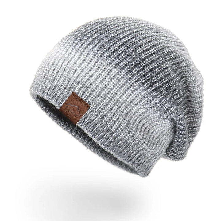 Unisex Rainbow Knit Beanie Hat: a soft, warm, and colorful accessory for winter fashion.