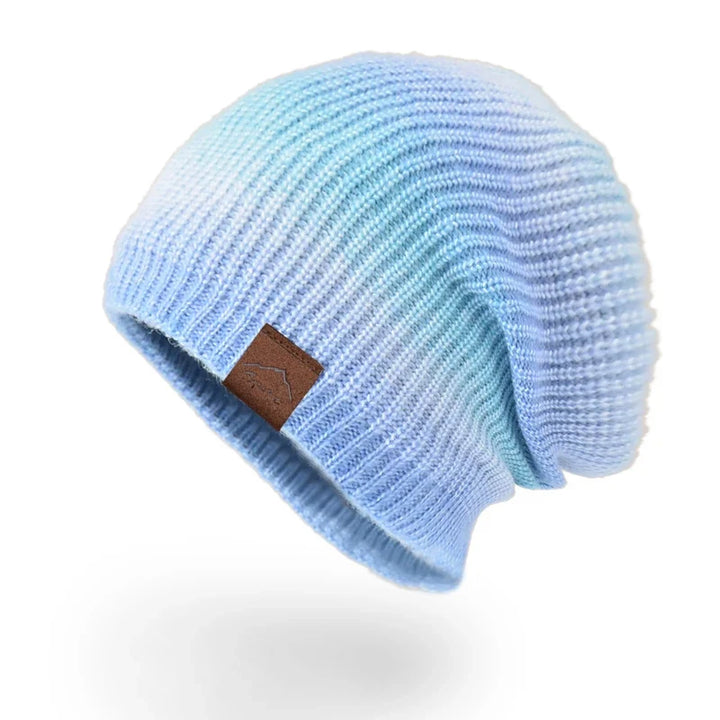 Snug, soft knit rainbow beanie hat. Keeps you warm, adds a pop of colorful winter fashion. Unisex.
