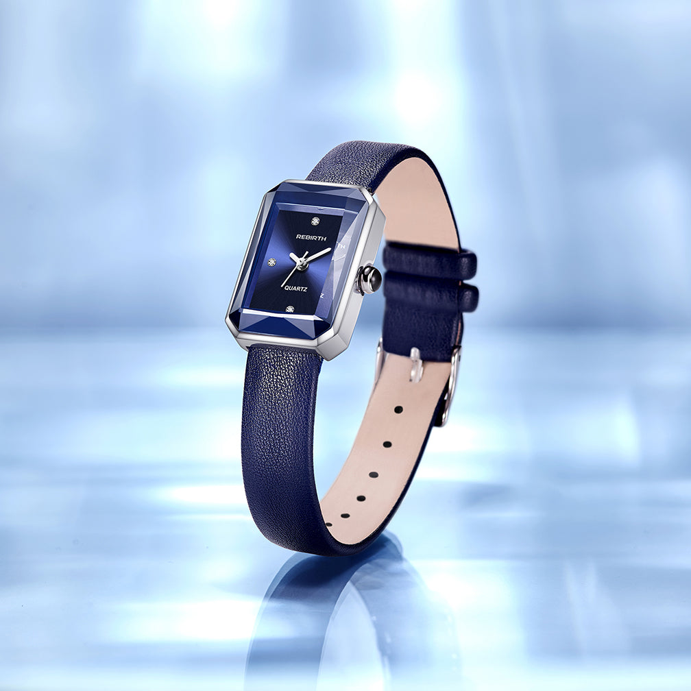Black genuine leather strap detail on an elegant unisex rectangular quartz watch.