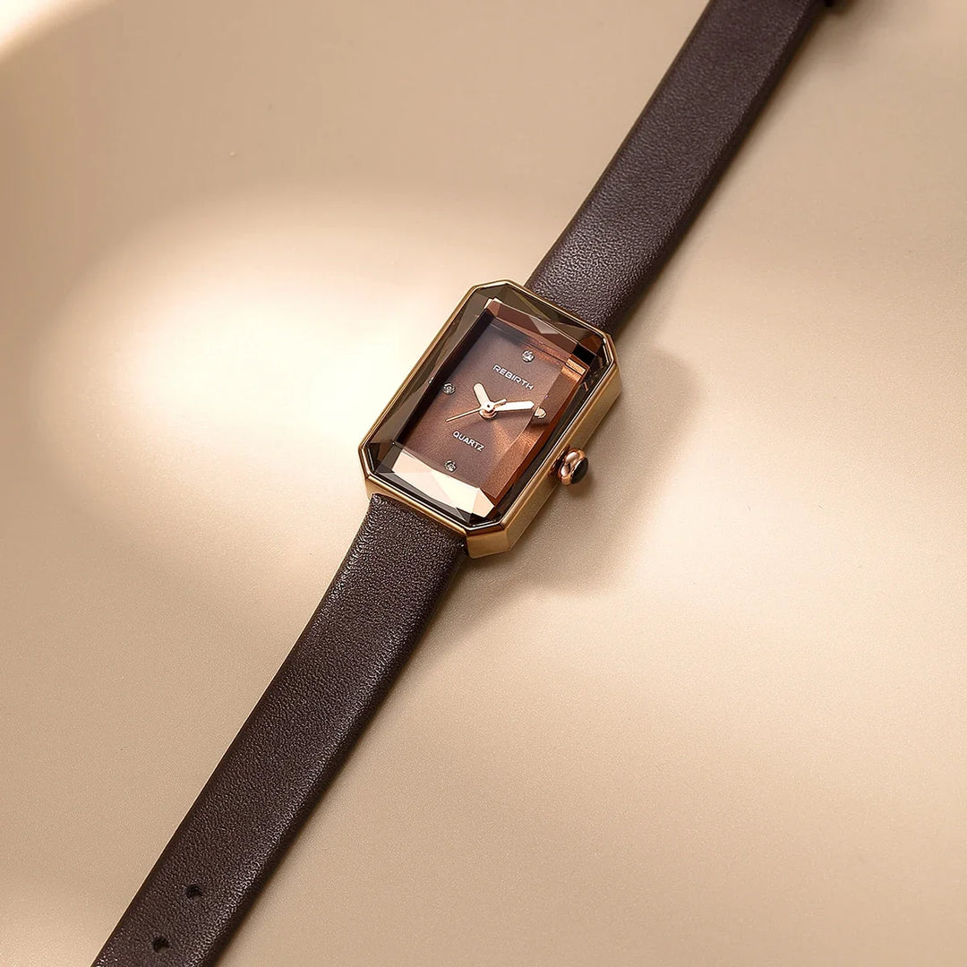Elegant unisex rectangular wristwatch with a brown leather strap, a timeless classic timepiece.