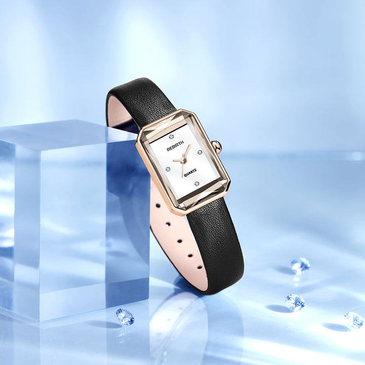 Stylish unisex rectangular quartz watch with a sleek black leather band on a wrist.