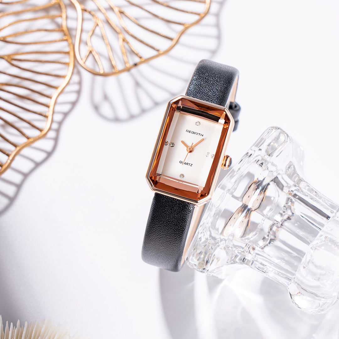 Back view of a unisex rectangular watch, showcasing its polished stainless steel case.