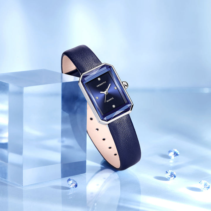 Brown genuine leather strap of a classic rectangular wristwatch, a durable and stylish accessory.