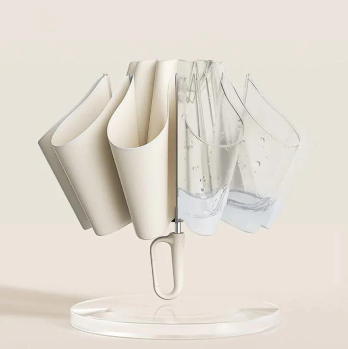 Pair of AeroGlow compact reflective umbrellas, one open, one closed, emphasizing portability for travel