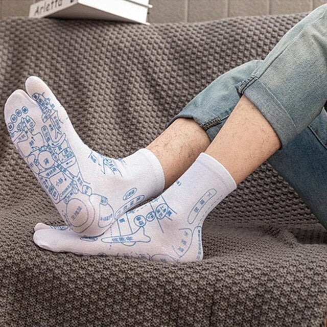 Close-up of acupressure reflexology socks, showing foot zone map for therapeutic stress & foot relief.