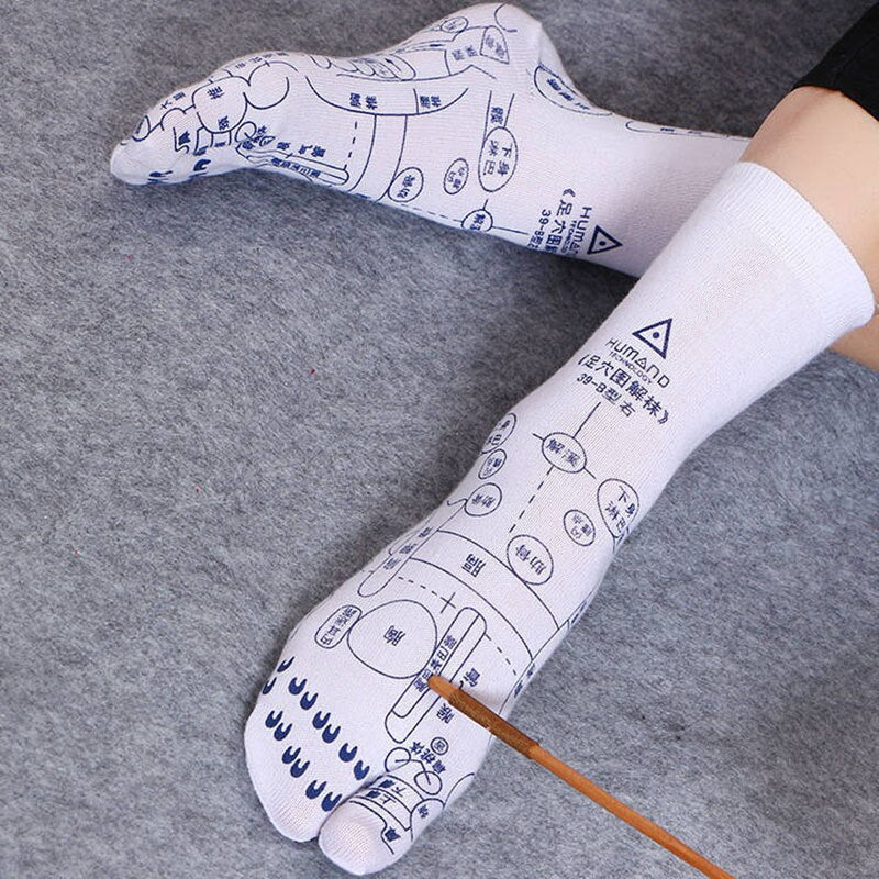 Person wearing unisex reflexology acupressure socks for comfort, foot massage & stress relief.