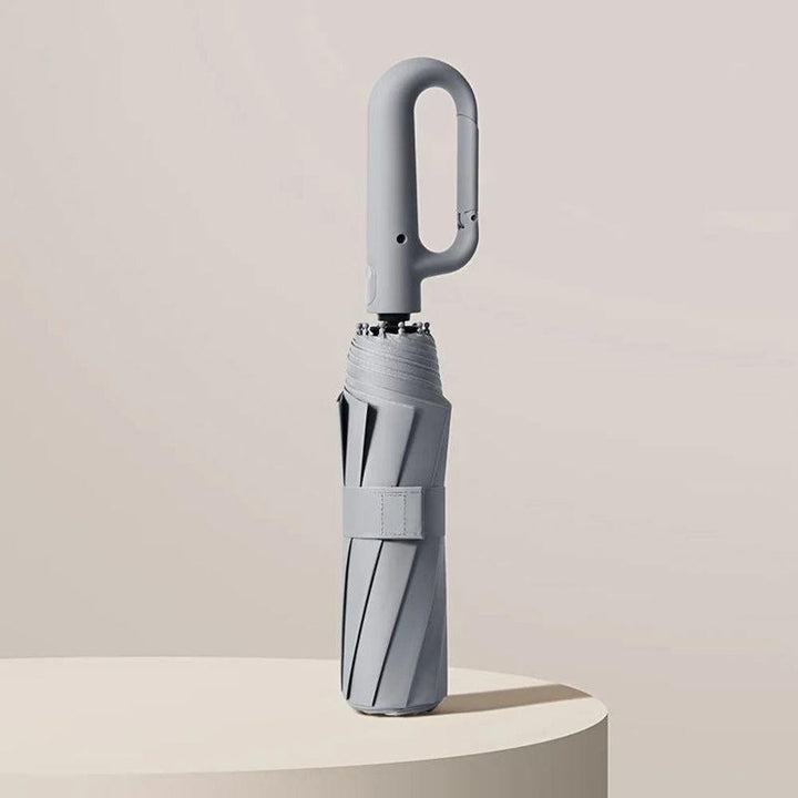 Ultra-compact unisex travel umbrella, reinforced & windproof for easy portability & reliable rain/sun protection.