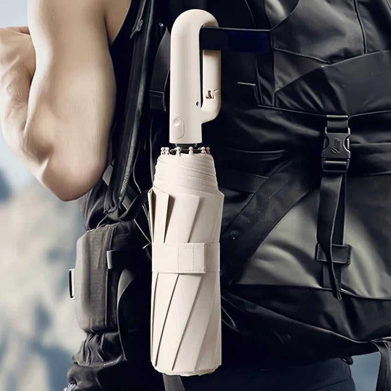 Essential travel accessory: compact unisex reinforced windproof umbrella for reliable rain & sun protection.