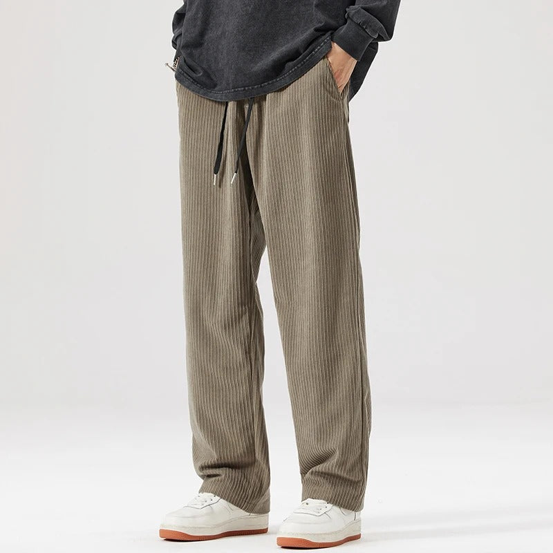Comfortable, soft, wide leg corduroy pants with relaxed fit & drawstring, unisex design.