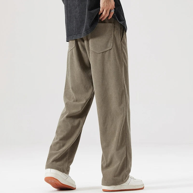 Stylish relaxed fit corduroy pants, unisex wide leg design, offering supreme comfort.