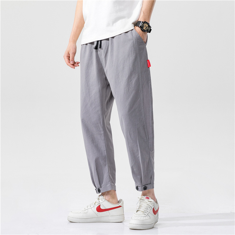 Lightweight unisex linen blend pants with a relaxed fit, ideal for breathable casual wear and summer comfort.