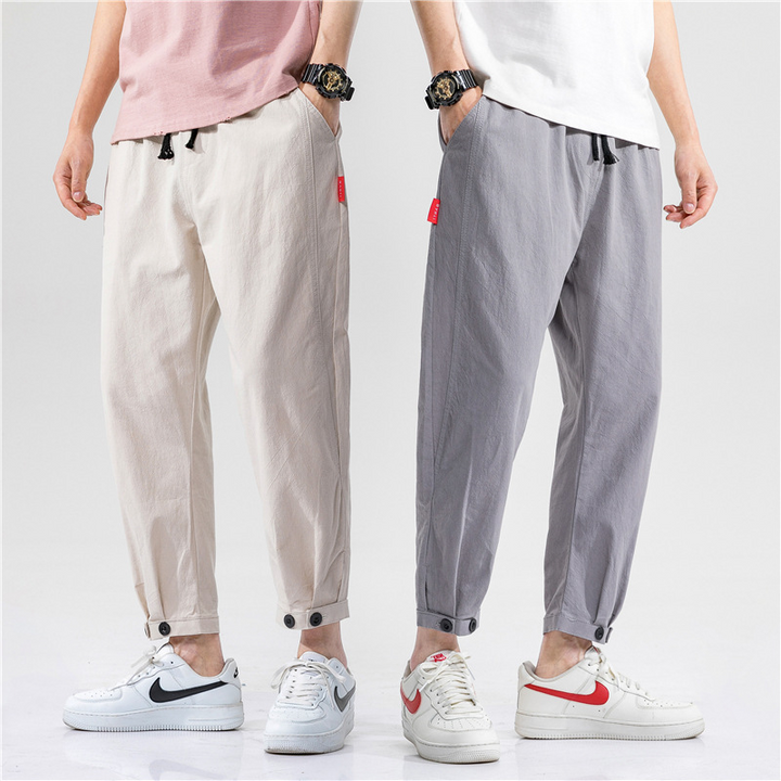 Full shot of relaxed fit unisex linen blend trousers, showcasing their casual comfort & breathable design for summer.