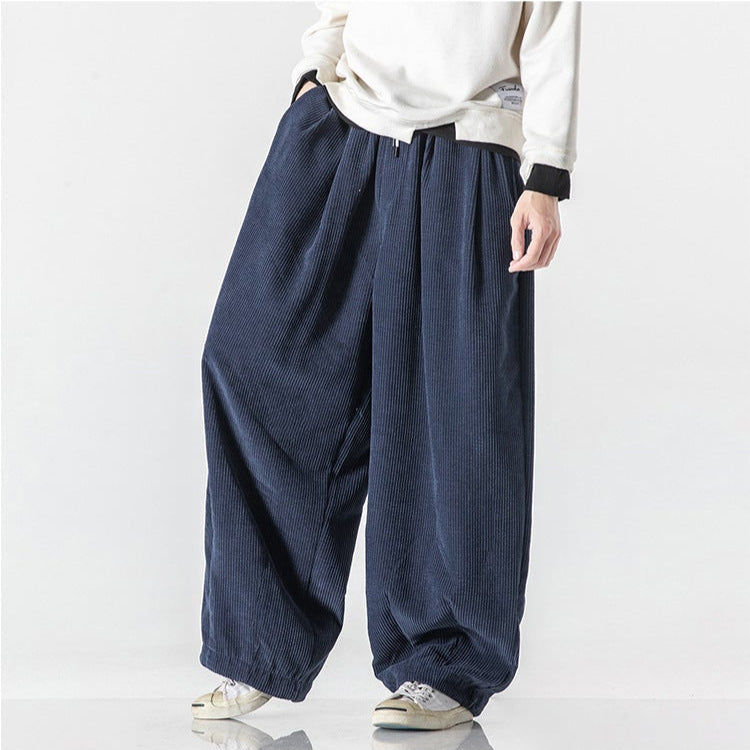 Back view of grey relaxed fit unisex sweatpants, highlighting pockets & comfortable design.