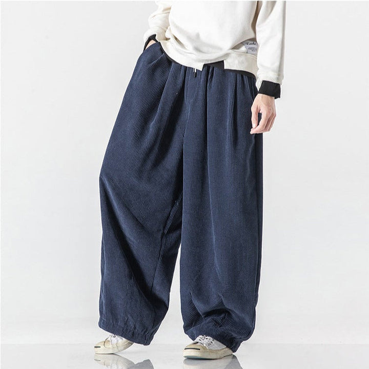Back view of grey relaxed fit unisex sweatpants, highlighting pockets & comfortable design.