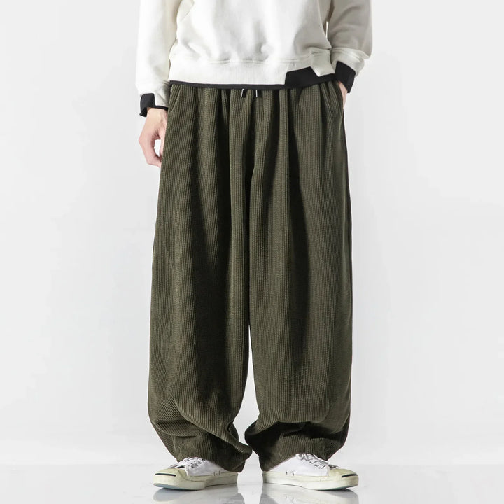 Army green relaxed fit casual pants, unisex design, comfy athleisure wear with drawstring.