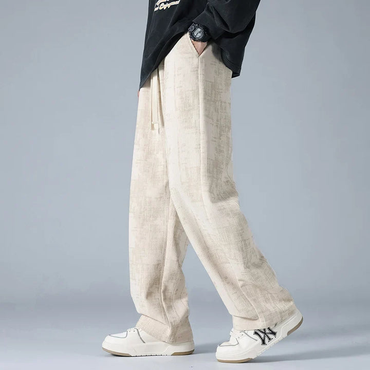 Black unisex sweatpants with a relaxed fit, offering ultimate comfort & versatile casual style.