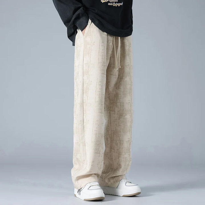 Model wearing grey relaxed fit sweatpants, showcasing ultimate comfort for casual or athleisure wear.