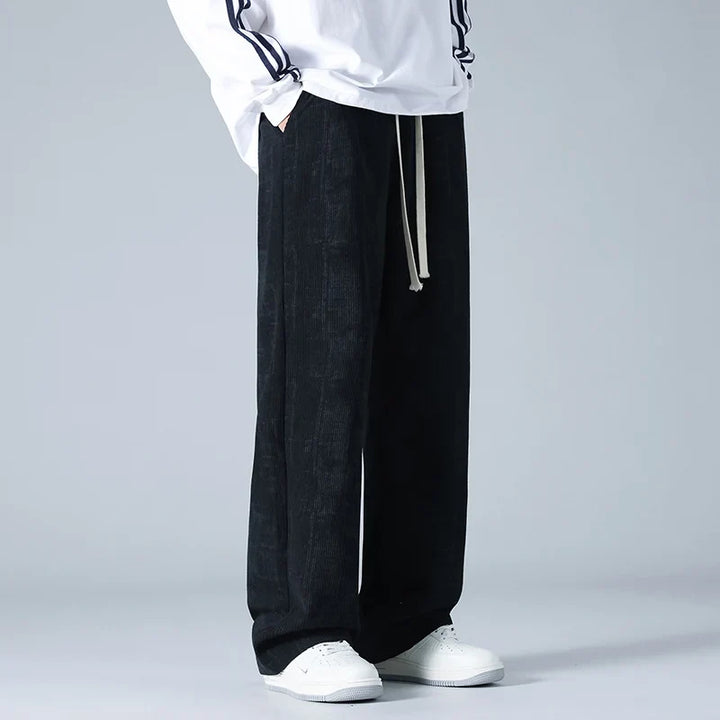 Stylish black relaxed fit athleisure pants, designed for ultimate comfort and unisex casual wear.