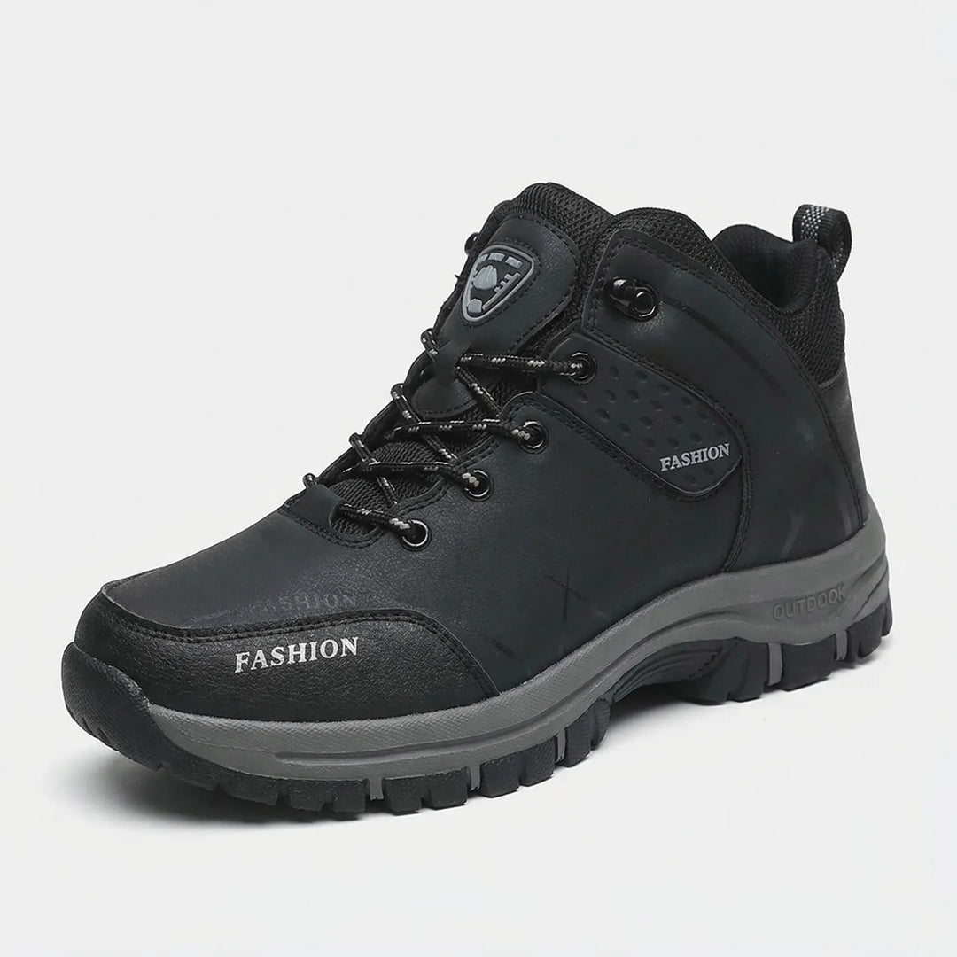 Unisex retro ankle hiking boots worn on a rocky trail, ideal water repellent footwear for outdoor adventure.