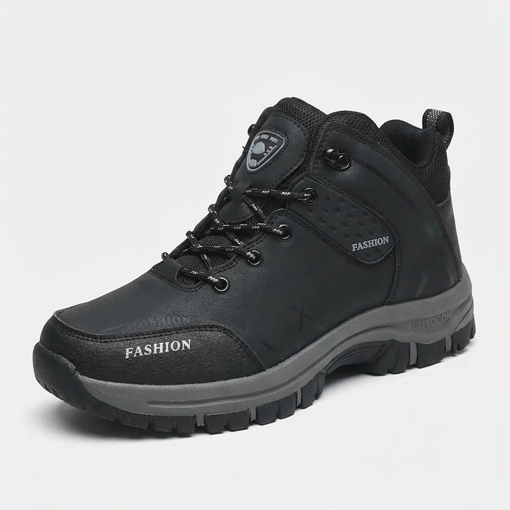 Unisex retro ankle hiking boots worn on a rocky trail, ideal water repellent footwear for outdoor adventure.