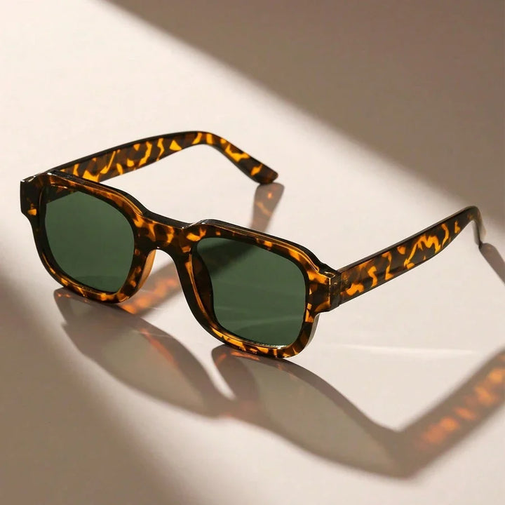 Unisex retro bold frame sunglasses offering UV protection. Stylish fashion eyewear for eye protection and statement.